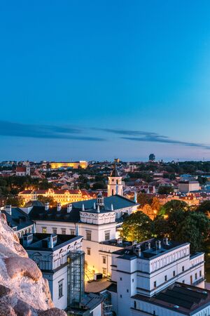 Vilnius, Lithuania, Eastern Europe. Aerial View Of Historic Center Cityscape In Blue Hour After Sunset. Travel View Of Old Town In Night Illuminations. Palace Of The Grand Dukes Of Lithuaniaの写真素材