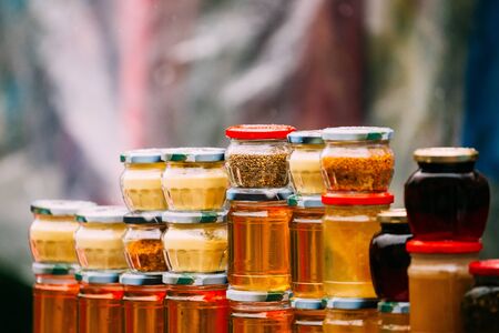 Various Jars With Sweet Tasty Yummy Jams. Jam Made From Walnuts, Pine Cones, Walnuts, Honey. Traditional Healthy Cuisineの写真素材
