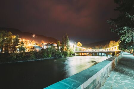 Borjomi, Georgia. Night View Of Bridge Of Beauty Over Kura River Passing Through City. Evening Night Illuminationの写真素材