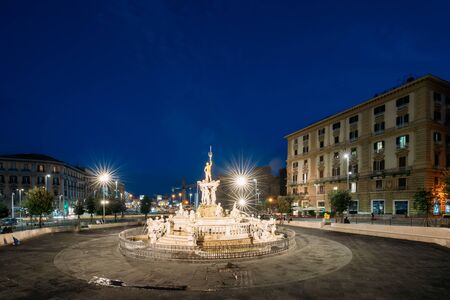 Naples, Italy. Fountain Of Neptune On Piazza Municipio In Evening Or Night Illuminations.の写真素材