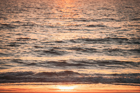 Sea Water Surface At Sunset. Natural Sunrise Warm Colors Of Ocean.