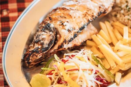 Goa, India. Fried European Bass With Potatoes And Salad On Dish.の写真素材