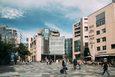 Oslo, Norway. People Walking Near Residential Multi-storey Houses In Aker Brygge District In Summer Evening. Famous And Popular Place.のeditorial素材