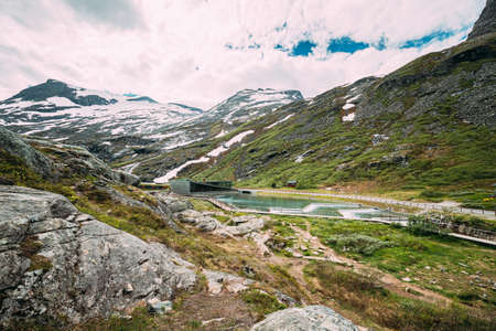 Trollstigen, Andalsnes, Norway. Visitor Centre Near Serpentine Mountain Road Trollstigen. Famous Norwegian Landmark And Popular Destination. Norwegian County Road 63 In Sunny Summer Dayの写真素材