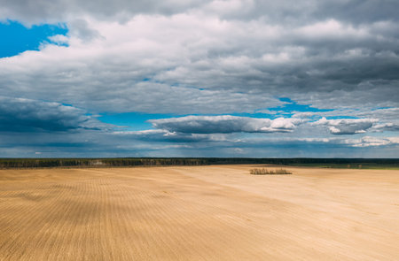 Aerial View. Amazing Natural Dramatic Sky With Rain Clouds Above Countryside Rural Field Landscape...