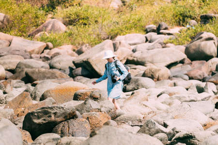 Kanica, Goa, India. People Standing On Pile Of Stones And Taking Photo At Sunny Summer Dayの写真素材