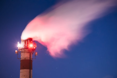 Telecommunications Cell Phone Towers With Antennas Installed On Factory Chimney. Plant Pipe With...