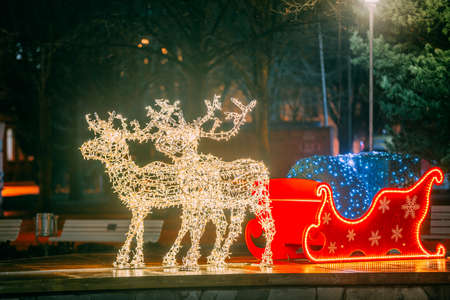 Many Festive Lights Lamps In Shape Deers Harnessed To A Christmas Sleigh. Night Festive Illumination. Decorative Streets Elements In Christmas Xmas Holiday Seasonの写真素材