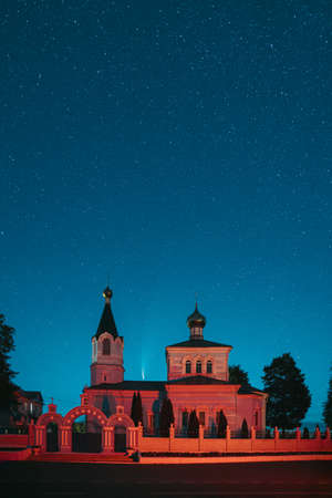 Korma Village, Dobrush District, Belarus. Comet Neowise C2020f3 In Night Starry Sky Above St. John The Korma Convent Church In Korma Village. Famous Orthodox Church And Historic Heritageの写真素材