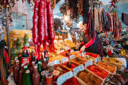 Batumi, Georgia. Suspended Bunches Of Dried Fruit And Diversity Of Churchkhela, Traditional Georgian Candle Shaped Candy Over Market Counter With Varicoloured Spices, Traditional Saucesのeditorial素材