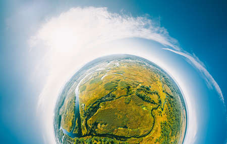 Aerial View Green Forest Woods And River Landscape In Sunny Summer Day. Top View Of Beautiful European Nature From High Attitude. Drone View. Birds Eye View. Little Small Planet Conceptの写真素材