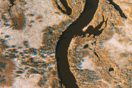Belarus. Aerial View Of Dry Grass And Curved River Landscape In Early Spring Day. High Attitude...
