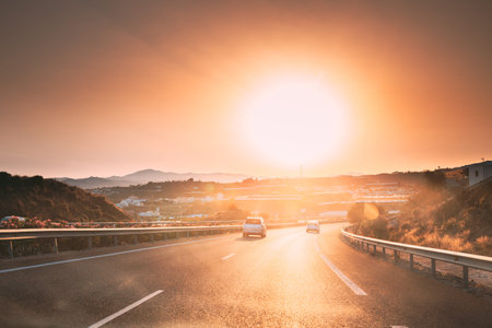 Movement Of Vehicles On Freeway, Motorway E-15 Near Malaga In Spain. Sunset