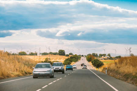 Tarifa, Spain. Traffic On N 340 Road. Windmills, wind turbines for electric power production on horizonの写真素材