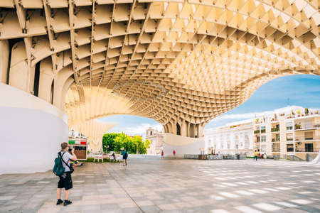 Seville, Spain. Tourist Taking Picture Of Metropol Parasol is a wooden structure located Plaza de la Encarnacion square, in old quarter of Seville, Spainのeditorial素材