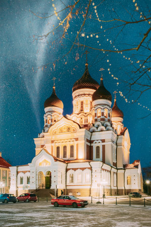 Tallinn, Estonia. Night Starry Sky Above Traditional Old Architecture Skyline In Old Town. Alexander...