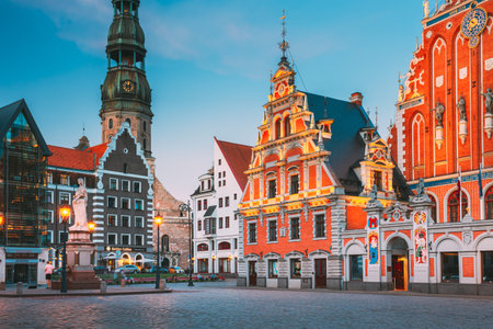 Riga, Latvia. Scenic Town Hall Square With St. Peters Church, Schwabe House, House Of Blackheads....