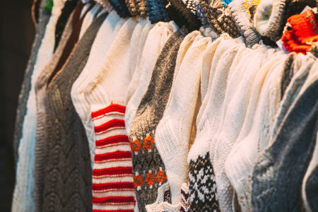 Various Colorful Knitted Traditional European Warm Clothes - Socks At Winter Christmas Market....