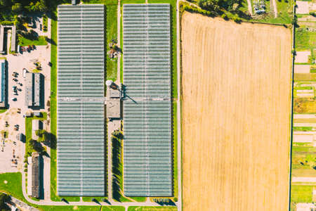 Aerial View Greenhouses For Growing Flowers, Vegetables And Fruits. Agricultural And Industrial Buildingsの写真素材