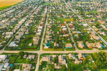Aerial View Of Town Village Cityscape Skyline In Summer Day. Residential District, Houses And Garden Beds In Birds-eye View.の写真素材