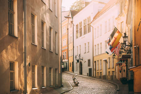 Tallinn, Estonia. Empty Puhavaimu Street In Old Town During Sunset. Motorcycle Parked On Old Streetの写真素材