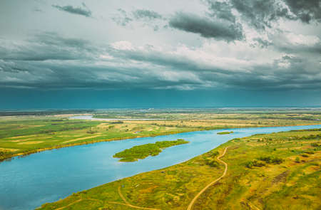 Rechytsa, Gomel Region, Belarus. Aerial View Of Dnieper River. Sky Above Green Meadow And River Landscape. Top View Of European Nature From High Attitude In Summer. Birds Eye Viewの写真素材
