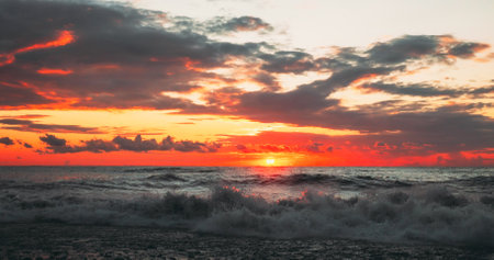 Sun Is Shining Over Horizon At Sunset Sundown. Sea Ocean Waves Iの写真素材