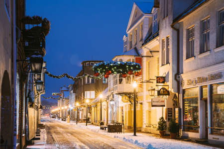 Parnu, Estonia. Night View Of Famous Ruutli Street With Old Buildings, Restaurants, Cafe, Hotels And Shops In Festive Evening Night Christmas Xmas New Year Illuminationsのeditorial素材
