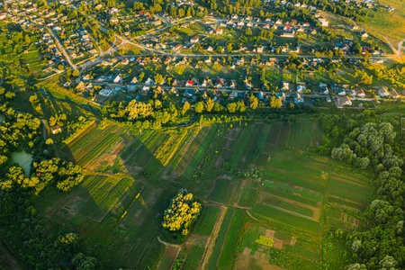Aerial View Of Vegetable Gardens In Small Town Or Village. Skyline In Summer Evening. Village Garden...
