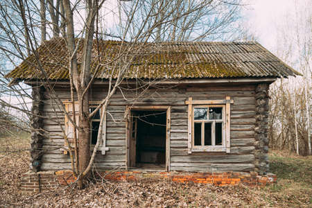Abandoned Ruined Old Wooden Village House In Chernobyl Resettlement Zone. Belarus. Chornobyl Catastrophe Disasters. Dilapidated House In Belarusian Village. Whole Villages Must Be Disposed. Radioactivity Zone.の写真素材