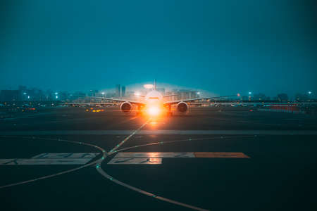 Aircraft Airplane Stand On Runway In Evening Night Time.の写真素材