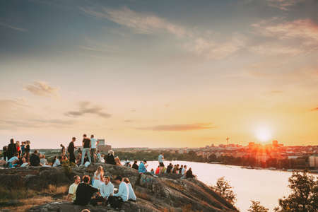 Stockholm, Sweden. Young People Resting In Skinnarviksberget Mountain Party Place During Summer Sunset.のeditorial素材