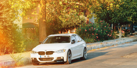 Front View Of white BMW 320d F30 Car Parked In Street. Faceliftのeditorial素材