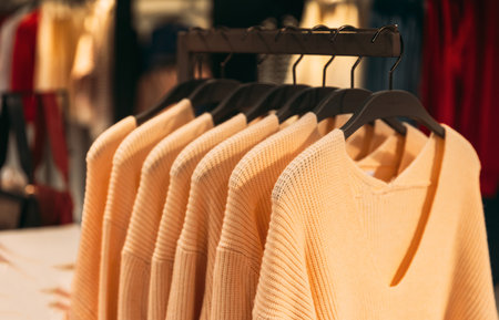 Female Casual Clothes sweatshirts blouse cardigan In Store Of Shopping Center. shelf display in shop mall store. Store Of Shopping Center. retail saleの写真素材