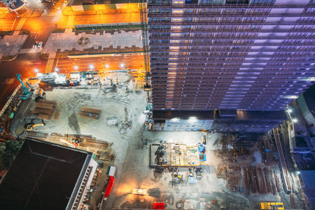 Development Multistorey Residential Building in night hours. development on construction site. night...