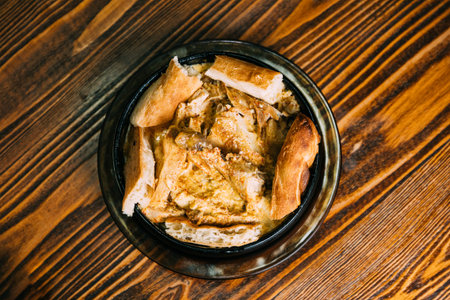 Chkmeruli or Shkmeruli is a traditional Georgian dish of chicken in garlic sauce. Georgian cuisine....