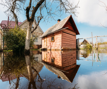 Sauna bath building In Water During Spring Flood floodwaters during natural disaster. Water deluge During A Spring Flood. inundation Riverの写真素材