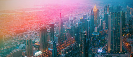 Aerial View Of Evening Night Scenic View Of Skyscraper. Street Night Illumination. Waterfront And Dubai Cityscape In Summer Evening. Night Scenic View Of Dubai Skyline. Film effect, lens flare, glow, film light, flare, highlight.の写真素材