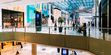 Dubai, UAE, United Arab Emirates - May 28, 2021: People visiting Dubai shopping mall. People going...