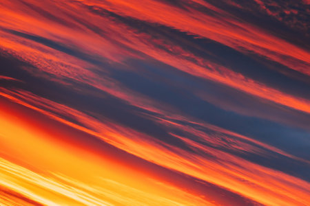 Unusual Sky Background. Abstract Saturated Orange-yellow Colors Of Clouds. Rich Orange Colors. Toned Pink-yellow Clouds. Sky Sunset Sunrise Background. Cloudy Sky. Sunny Cloudscapeの写真素材