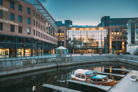 Oslo, Norway. View Of Residential Multi-storey Houses In Aker Brygge District In Summer Evening. Famous And Popular Place. Pier Jetty With Boats.のeditorial素材