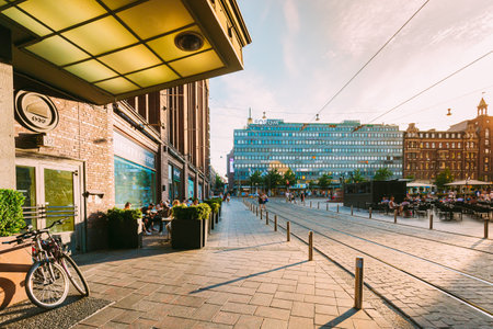 View of Kluuvikatu street, Helsinki, Finland. People walk down street on a summer evening. View of Mannerheimintie streetのeditorial素材