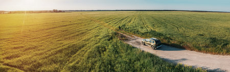 Aerial view of Renault Duster car SUV parked near countryside ro