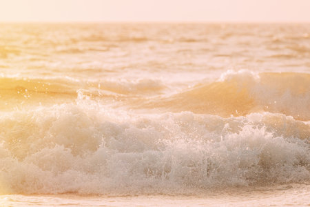 Riplpe sea ocean water surface with small waves. Close up of sea foam from breaking wave.の写真素材