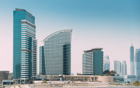 Hotel InterContinental Dubai Marina, an IHG Hotel and Crowne Plaza hotel. View of high-rise buildings of residential district in Dubai Marina in sunny day. Urban backgroundのeditorial素材