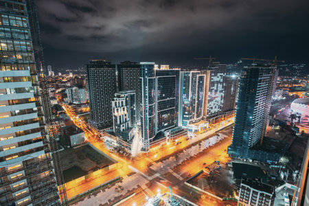 Street Night City Traffic and highrise houses . Elevated View Cityscape Skyline. Night Light Lighting. Industrial concept. Building industry.の写真素材