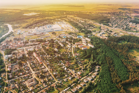 Aerial View Of Town Village Cityscape Skyline In Summer Sunny Morning. Daytime. Residential Houses. Small European City. Residential Areas And Industrialの写真素材