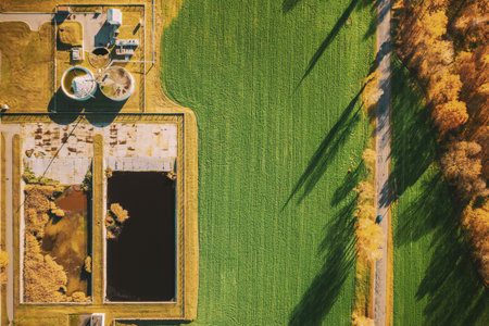 Aerial view gas station in sunny autumn rural landscape. Elevated view flat view gas station standing in a field in sunny autumn dayの写真素材