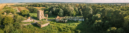 Aerial View Remains Of Yastrzhembsky Estate And Park Complex. Top View Of Old Five-storey Brick Water Tower. Drone View Of Beautiful European Nature In Summer Season. Birds Eye View. Panorama, Panoramic View. Borisovshchyna Village, Khoiniki District, Belarusの写真素材