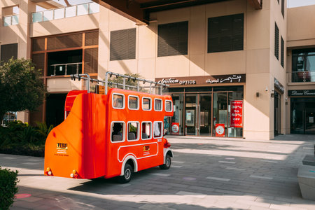Dubai, UAE, United Arab Emirates - May 25, 2021: Red touristic bus for sightseeing parking near shopping mall. Bus parked near shopping centre. City tour bus. City sightseeing tour in Dubai. City sightseeing tourのeditorial素材